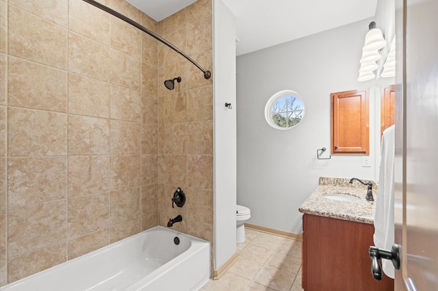 full bathroom featuring tile patterned flooring, vanity, toilet, and tiled shower / bath