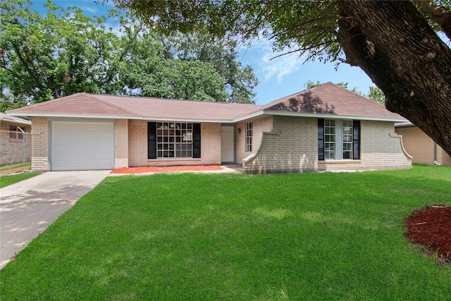 single story home featuring a garage and a front lawn