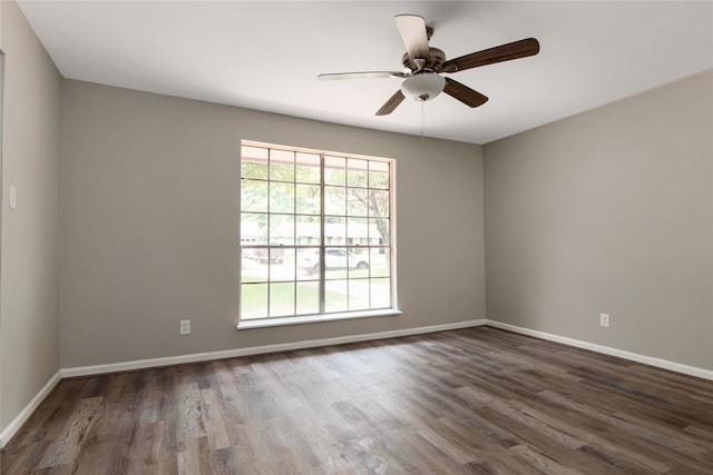 unfurnished room featuring ceiling fan and dark hardwood / wood-style flooring