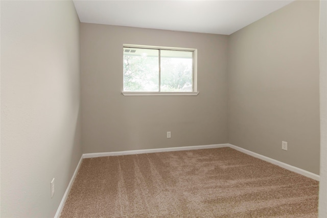 unfurnished room with carpet floors