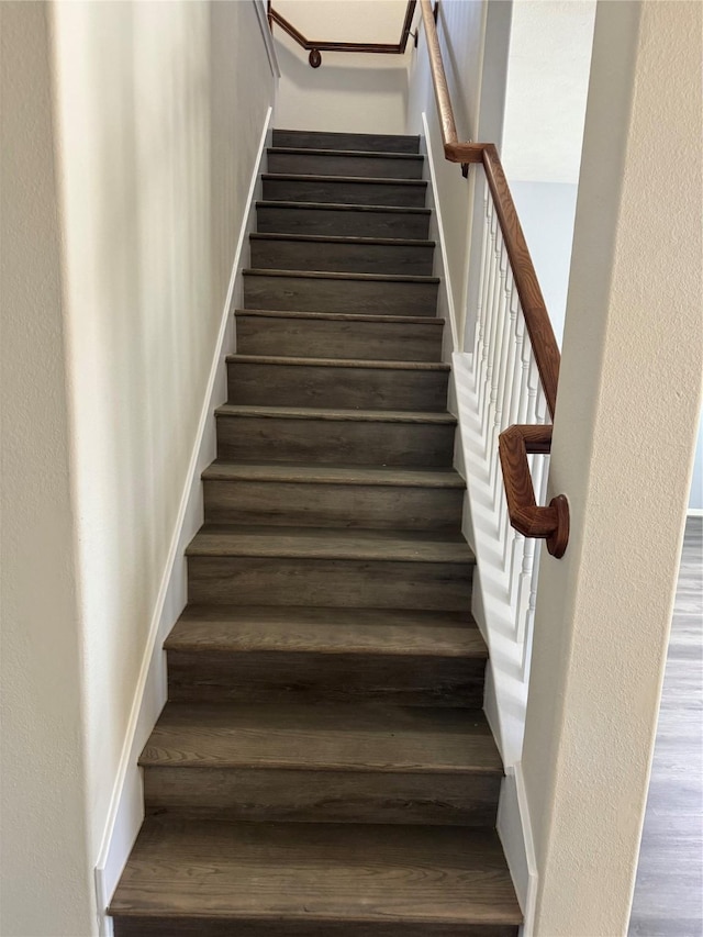 stairway featuring hardwood / wood-style flooring