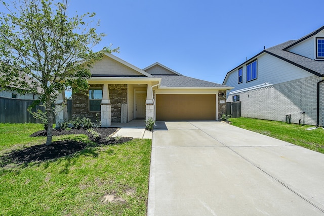 view of front of home with a garage and a front lawn