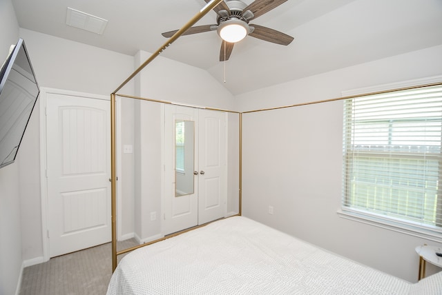 bedroom featuring carpet, ceiling fan, and lofted ceiling