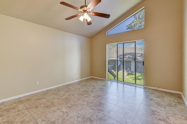 tiled empty room with ceiling fan and high vaulted ceiling