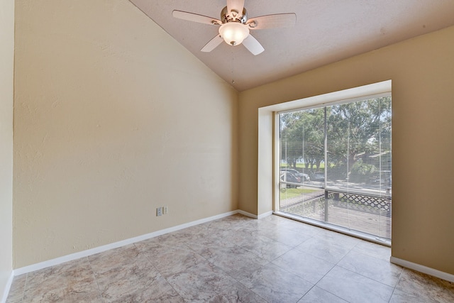 unfurnished room with ceiling fan and vaulted ceiling