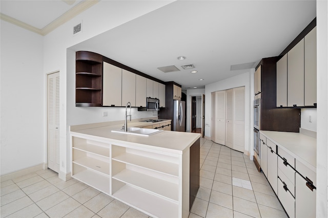 kitchen with stainless steel appliances, crown molding, sink, light tile patterned floors, and white cabinets