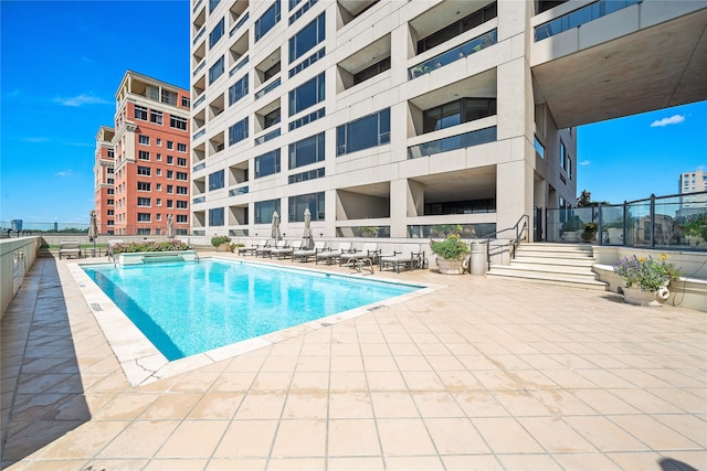 view of swimming pool featuring a patio