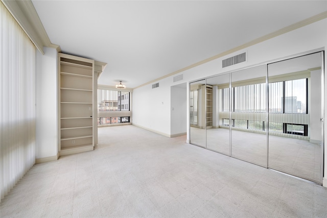 interior space featuring light carpet and a wealth of natural light