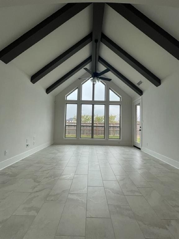 unfurnished living room with lofted ceiling with beams and ceiling fan