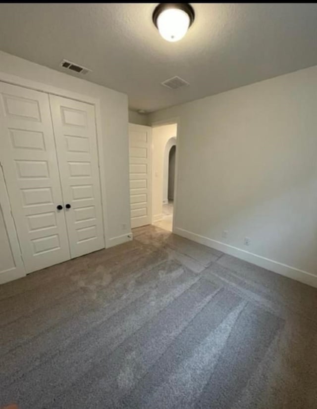 interior space with carpet floors and a closet