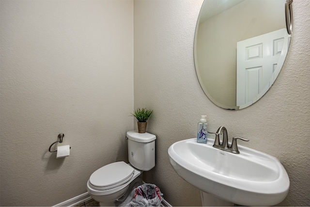 bathroom with sink and toilet