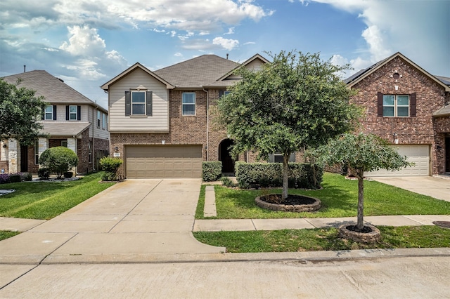 view of front of property with a garage and a front lawn