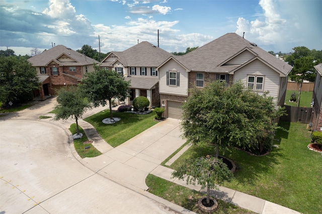 view of front of property featuring a front lawn and a garage