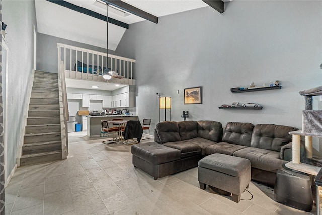 living room with beamed ceiling, high vaulted ceiling, and light tile patterned flooring