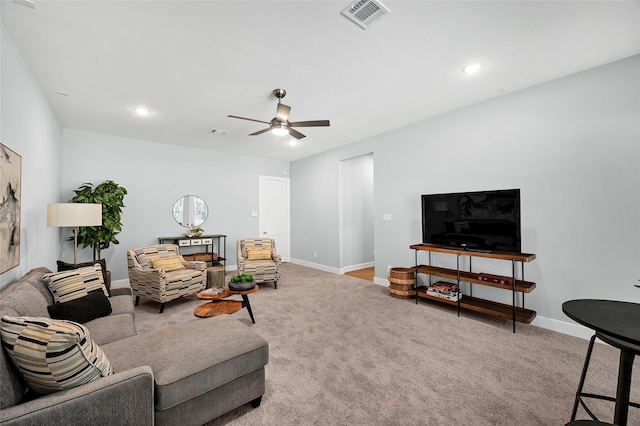 living room with light colored carpet and ceiling fan