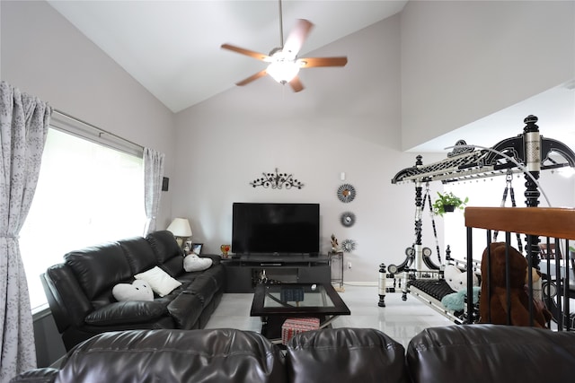 living room featuring high vaulted ceiling and ceiling fan