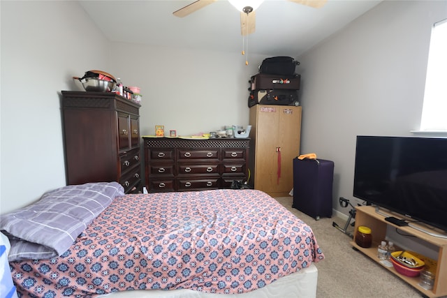 bedroom featuring light carpet and ceiling fan