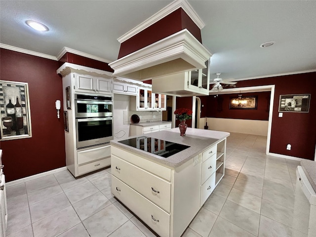 kitchen featuring a center island, a warming drawer, black electric stovetop, open shelves, and glass insert cabinets