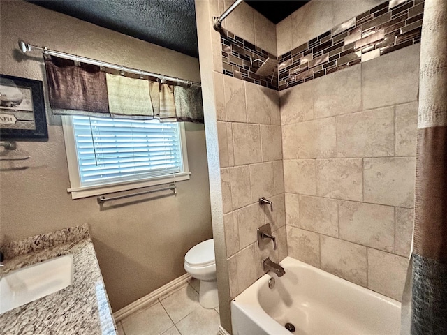 full bath featuring shower / bath combo, baseboards, toilet, tile patterned floors, and vanity