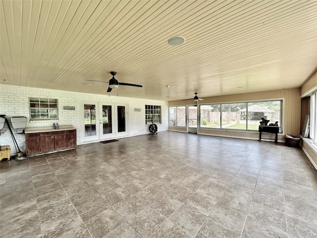 unfurnished sunroom featuring wooden ceiling