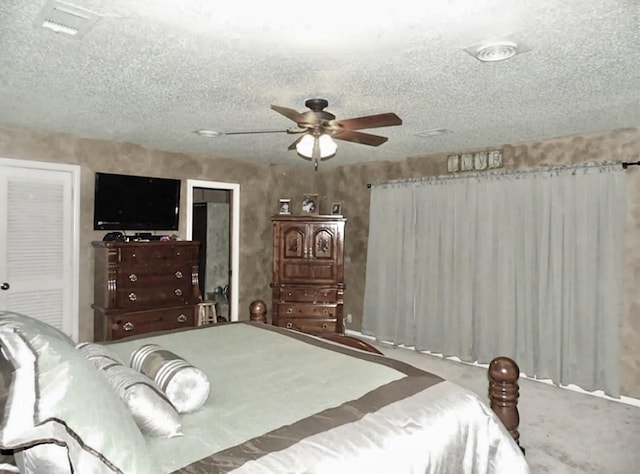 bedroom featuring a textured ceiling and ceiling fan