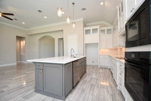 kitchen featuring black appliances, gray cabinets, white cabinetry, and a kitchen island with sink