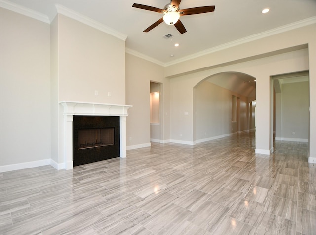 unfurnished living room with ceiling fan, light wood-type flooring, and ornamental molding