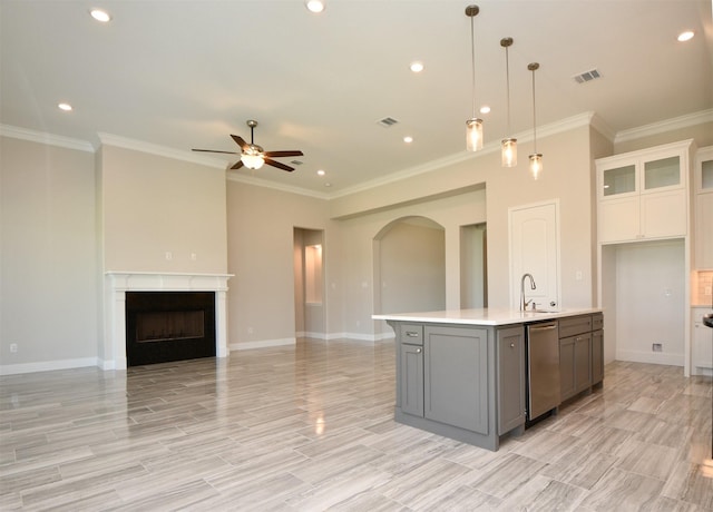 kitchen with ceiling fan, dishwasher, sink, crown molding, and white cabinets