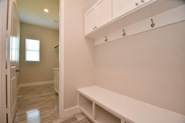 mudroom with light hardwood / wood-style flooring