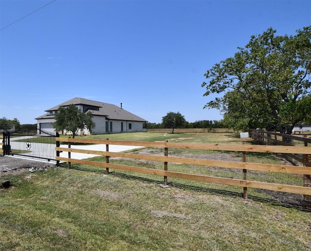 view of yard with a rural view