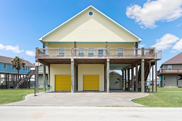 raised beach house with a carport, a garage, and a front lawn