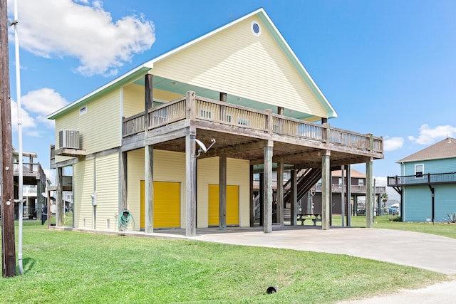 back of property featuring a lawn and a wooden deck