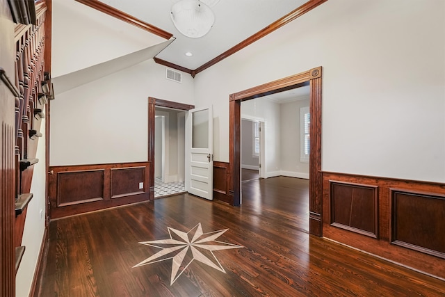 empty room with crown molding and dark hardwood / wood-style floors