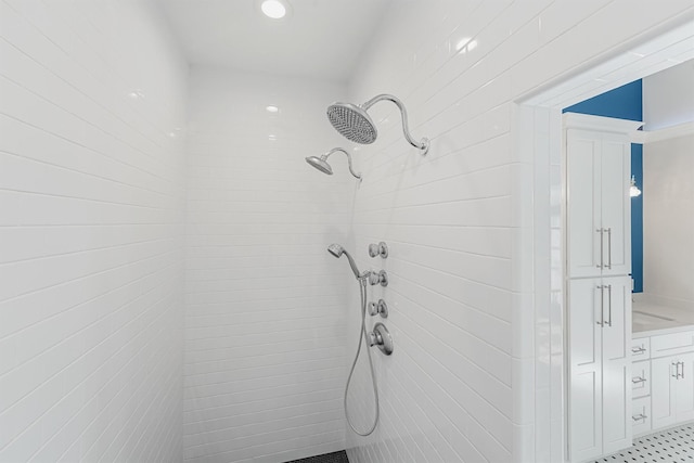 bathroom with a tile shower