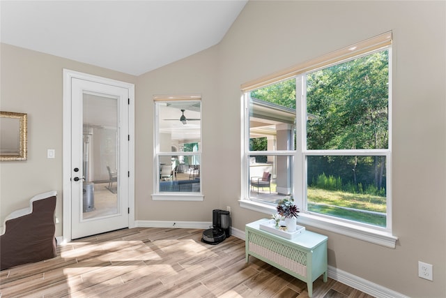 sitting room with vaulted ceiling and light hardwood / wood-style flooring