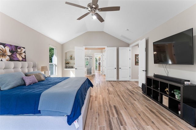 bedroom featuring lofted ceiling, light hardwood / wood-style flooring, and ceiling fan