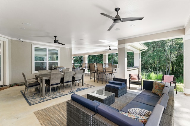 view of patio / terrace with outdoor lounge area, exterior bar, and ceiling fan