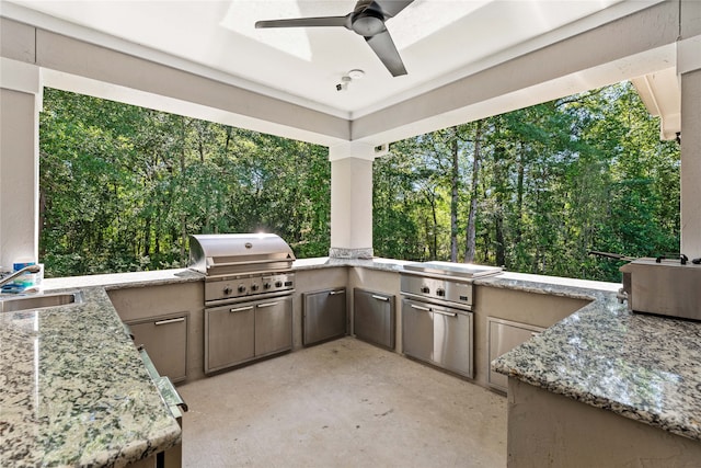 view of patio / terrace with sink, a grill, and an outdoor kitchen