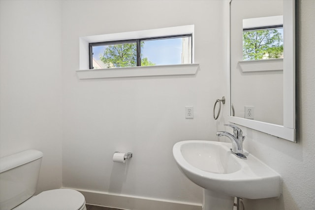 bathroom featuring sink and toilet