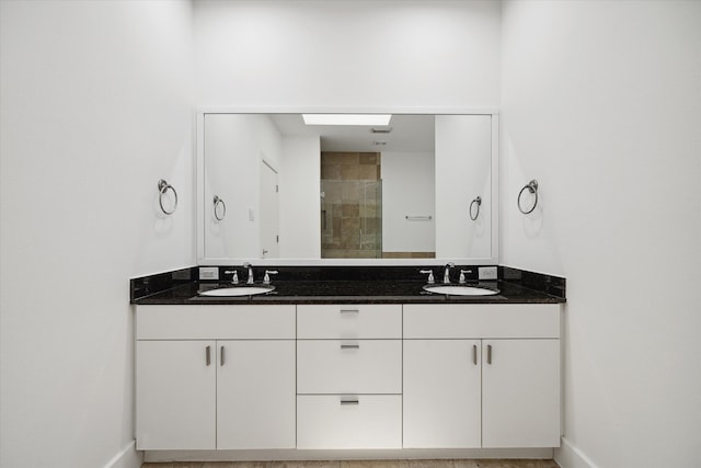 bathroom featuring large vanity and double sink