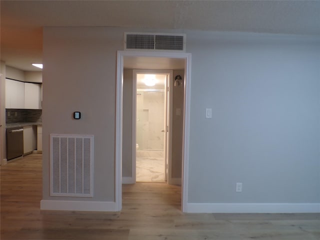 corridor featuring light hardwood / wood-style flooring