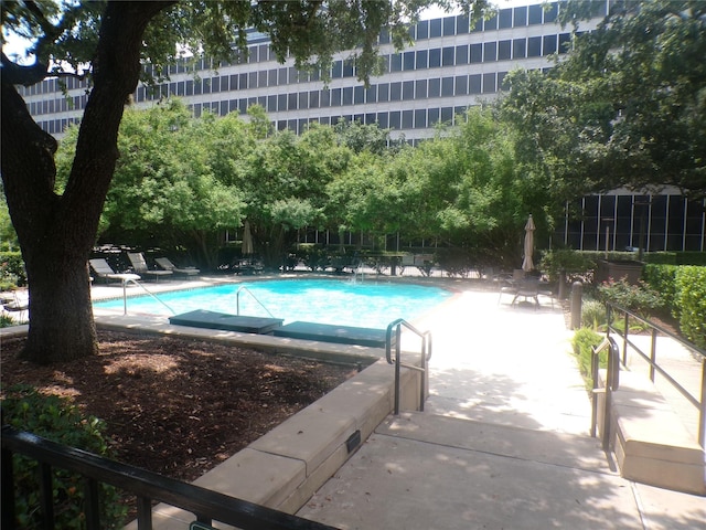 view of swimming pool with a patio