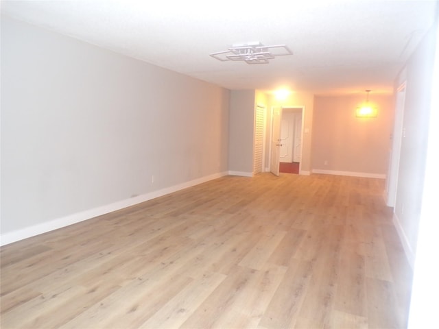 spare room with light wood-type flooring