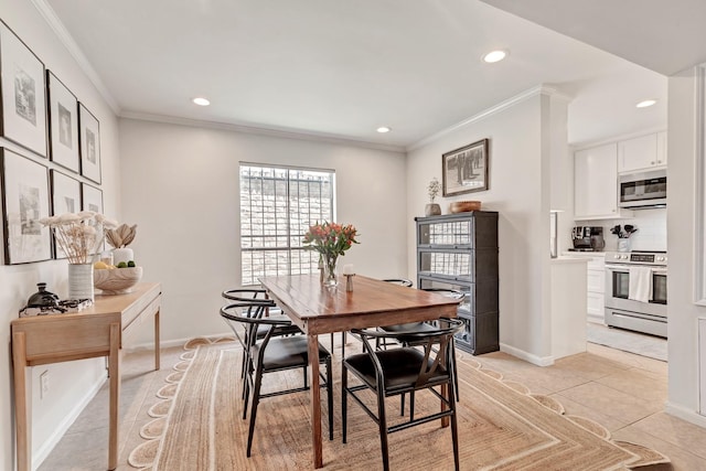 dining room featuring light tile patterned floors and ornamental molding