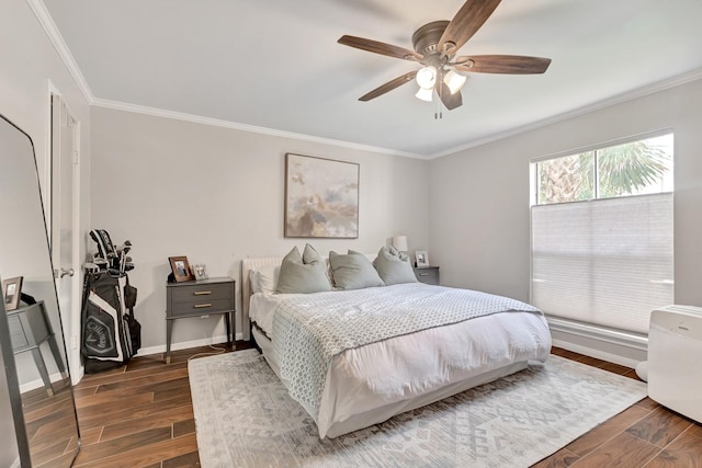 bedroom featuring ceiling fan and ornamental molding