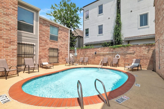 view of pool with a patio area