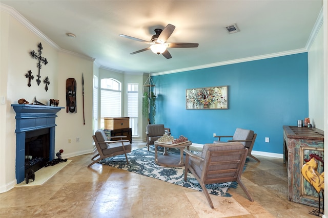 living room with ceiling fan and ornamental molding