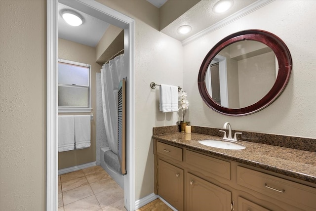 bathroom with vanity, shower / tub combo with curtain, and tile patterned floors