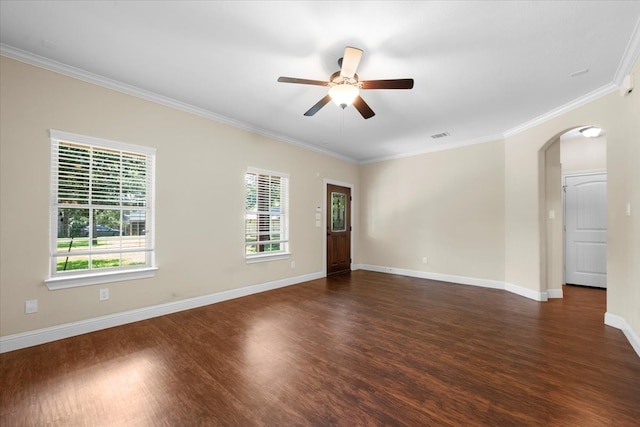 unfurnished room featuring ornamental molding, dark wood-type flooring, and ceiling fan