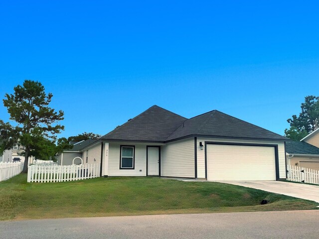 ranch-style house with a front yard and a garage